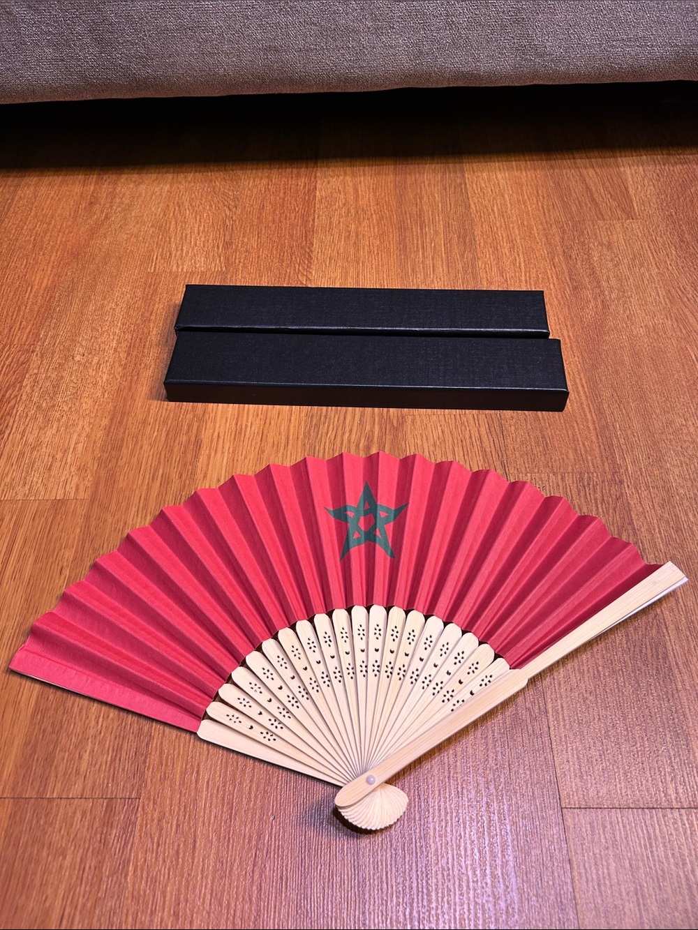 Red Handheld Folding Fan with Green Star Accent